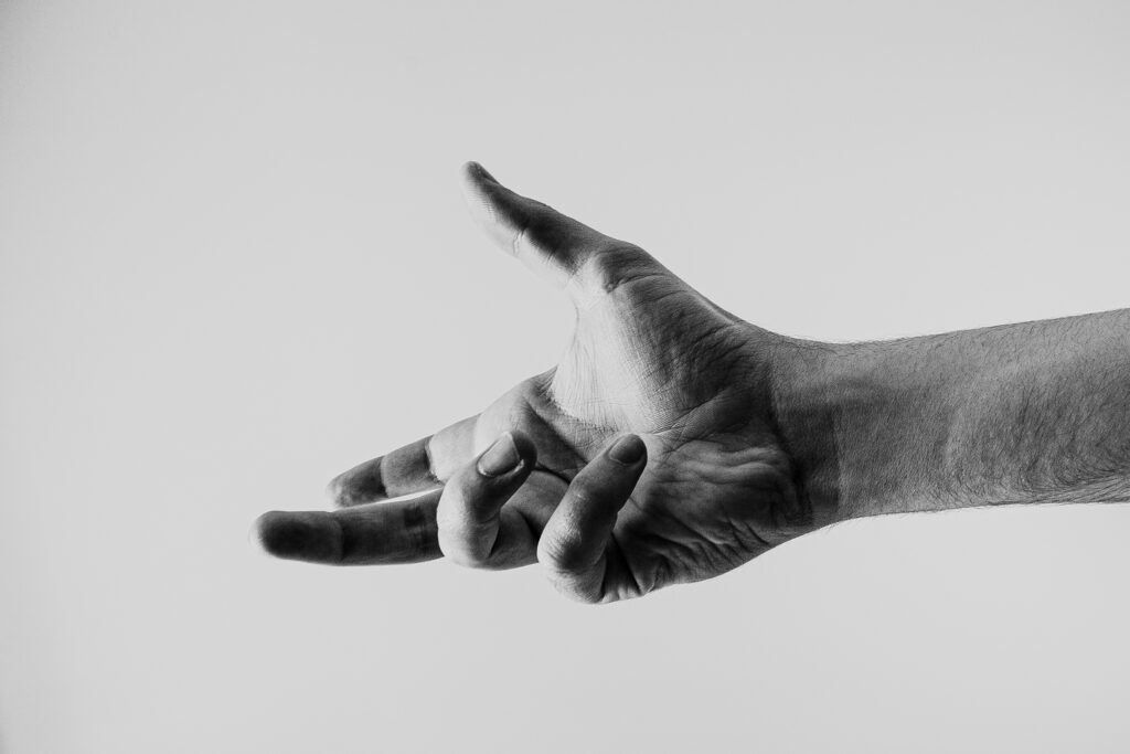 black and white picture of hand reaching out