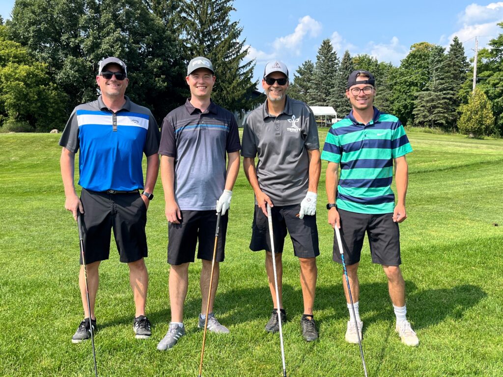 golf team of four men